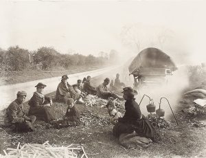 Photograph of people camping by the side of a country road dated 1897.