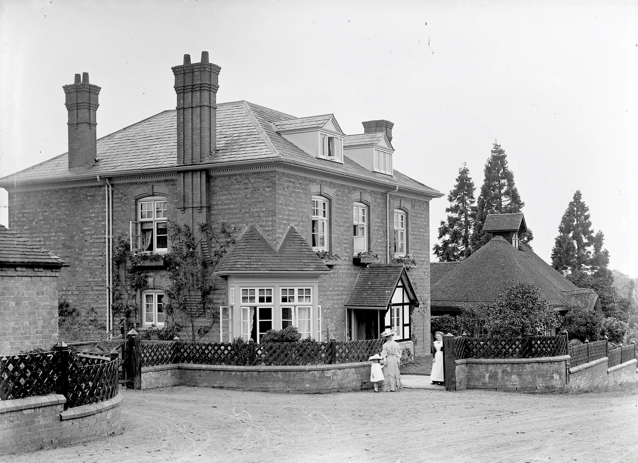 Black and white photograph of a sizeable brick house known as Hindlip Rectory.
