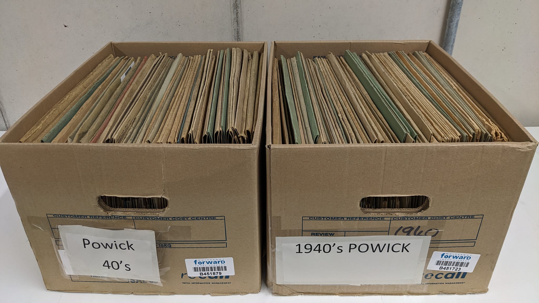 An image of two cardboard boxes of patient files for Powick Hospital awaiting cataloguing dated 1940's copyright Worcestershire Archives and Archaeology Service