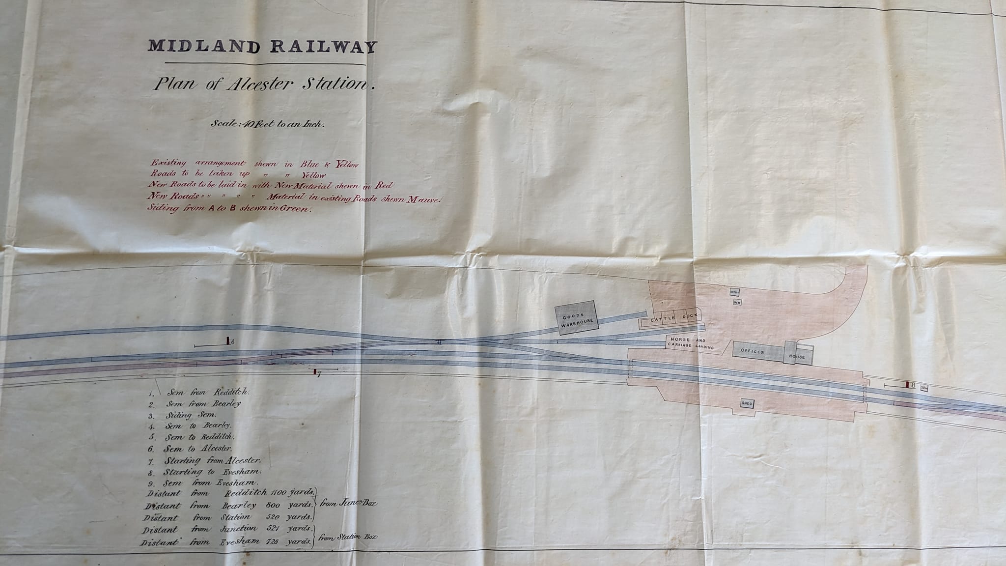 An image of a plan on paper of Alcester Railway station and Junction dated 1st December 1876.