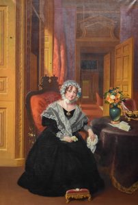 Colour painting of a young woman in a black dress with bonnet sat on a chair in a grand house