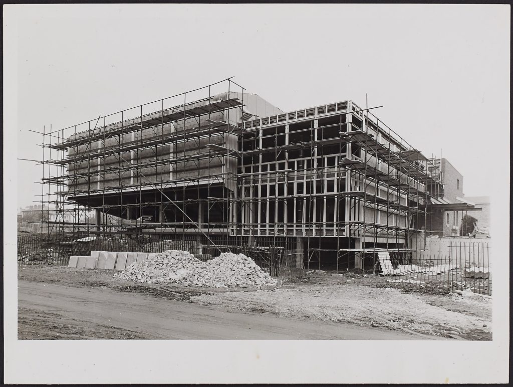 A photograph showing the Swan Theatre under construction dated to 1964-54.